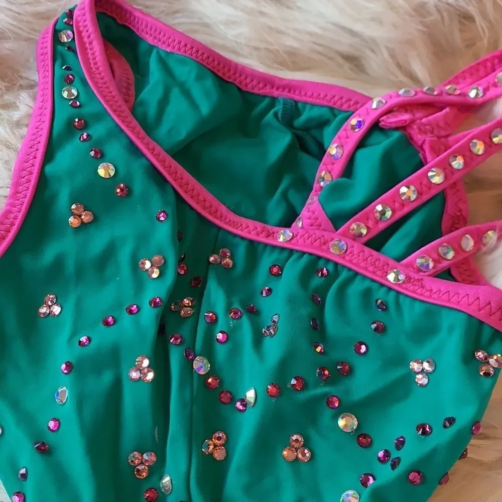 Custom dance costume with Swarovski Crystals. Teal and pink with arm sleeves